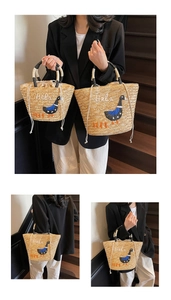 Detail of hand-woven straw tote with Hala duck embroidery and drawstring closure
