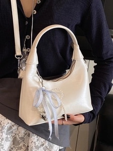 Minimalist beige oil wax leather handbag with cute bow charms and pearl heart pendants