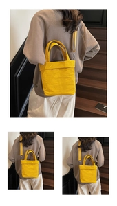 Detail showing the pleated nylon texture and versatile straps of the yellow tote bag