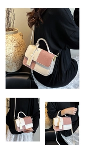 Close-up of pink and white patchwork handbag with fashion metal buckle and handle