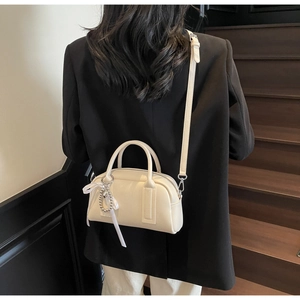 Chic cream white mini Boston bag with lychee grain texture and silver bead charm detail
