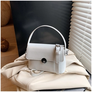 Detail view of white oil wax leather mini square bag with silver round twist lock detail