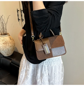 Contrast color retro crossbody bag with premium leather texture shown on shoulder