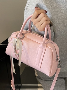 Pink lychee grain leather Boston handbag with bow and pearl charms in trendy Korean style