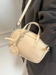 Chic cream beige Boston bag with lychee texture and adjustable crossbody strap for women