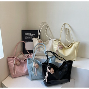 Detailed row of oil wax leather tote bags in five pastel colors with cute bear charms