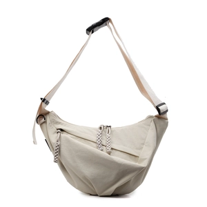 Minimalist cream-colored nylon crescent bag with double zipper and adjustable strap