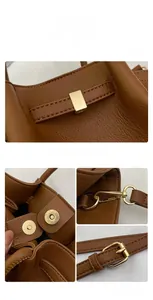 Close-up of brown litchi pattern leather tote bag with elegant golden hardware details