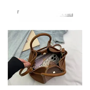Top view of brown leather bucket bag showing large capacity for phone and wallet storage