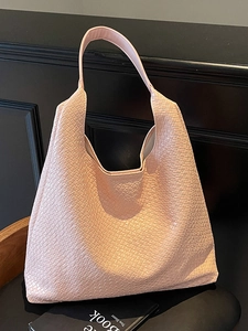 Pink woven texture tote bag with spacious interior and elegant top handles for daily commute