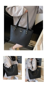 Detail of black woven tote bag featuring gold hardware and large capacity for commuting