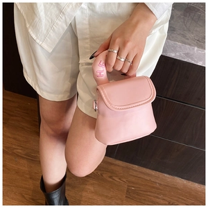Pink mini crossbody bag featuring a soft faux fur handle with HE embroidery detail