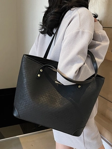 Large black woven tote bag with shoulder strap, perfect for office and daily commuting