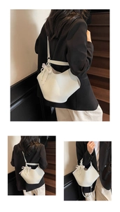 Close-up of white lychee pattern bucket bag with lace pearl bow and adjustable strap