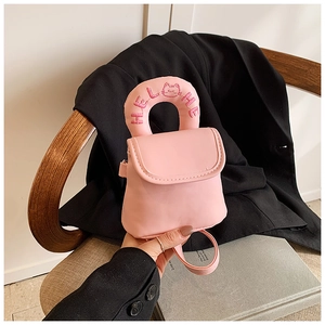 Close-up of pink mini PU handbag featuring Hello embroidery and cute cat design