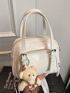 White oil wax leather pillow handbag with double zippers and a cute plush bear pendant