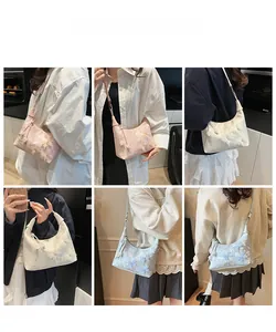 Lace butterfly shoulder bag in pink, white and blue shown on model in daily life