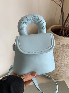 Light blue mini crossbody bag with embroidered Hello handle and minimalist cat design