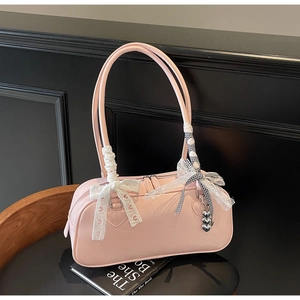 Pink patent leather Boston bag with white lace bow and silver heart charms detail