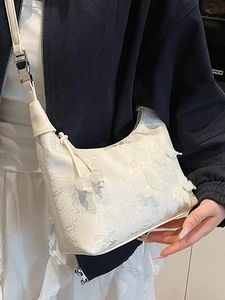 White lace floral shoulder bag with 3D butterfly decor and beaded tassel strap detail