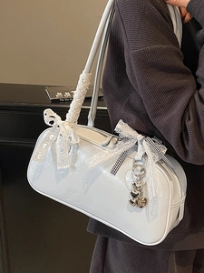Glossy light blue Boston shoulder bag with lace bows and heart pendant detail