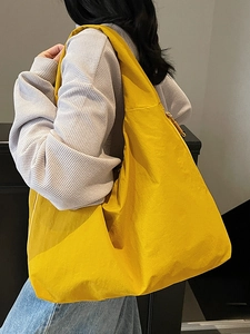 Minimalist bright yellow large capacity tote bag with pleated texture for casual commuting