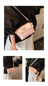 Detail of pink woven texture PU leather square bag with COIN 2DN metal lettering