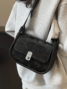 Chic black vintage crossbody square bag with distressed leather texture and silver buckle