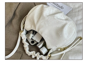 Top view of white snakeskin pattern bag showing internal capacity for daily essentials