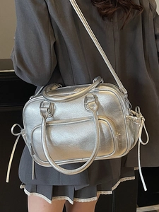 Metallic silver Boston bag in pleated faux leather with bow details and shoulder strap