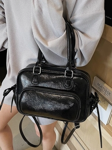 Glossy black patent leather Boston bag with silver hardware for handbag or crossbody use