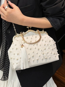Elegant white satin evening bag with lace embroidery, pearls, and tassel detail