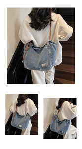 Detailed close-up of blue denim tote bag with brown braided rope shoulder straps