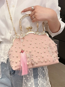 Elegant pink pearl evening bag with gold floral embroidery and tassel for gala events