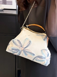 Vintage style floral embroidered handbag with gold metal clasp and chain strap for women