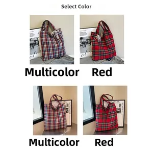 Detail of red and blue checkered canvas tote bag with thick cotton shoulder straps