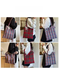 Detail view of plaid tote bag featuring lace bow accent and spacious canvas texture