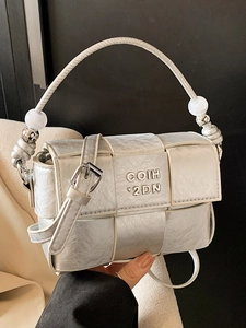 Silver woven minimalist square handbag with beaded handle and metallic finish