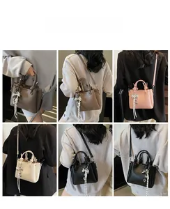 Litchi texture handbag with striped bow charm shown in various colors on models