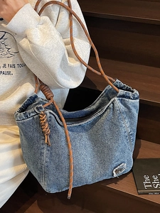 Retro denim tote bag with woven rope straps and distressed details for women
