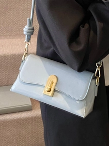 Chic light blue patent leather square crossbody bag with gold lock and knot shoulder strap