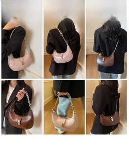 Detailed views of pink and brown half-moon underarm bags with metal chain straps