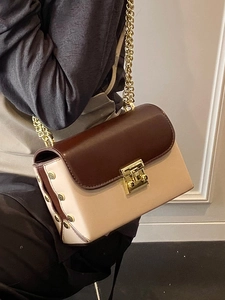 Elegant two-tone chain crossbody bag in brown and off-white with gold square lock