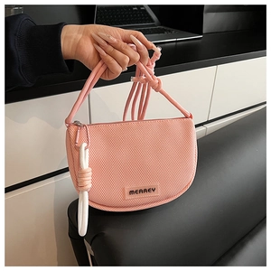 Pink mesh crossbody bag featuring durable knot straps and metal carabiner detail