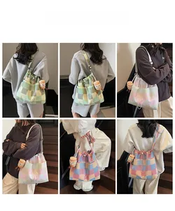 Detail showing checkered canvas tote bags with drawstring closure and cute plush charm