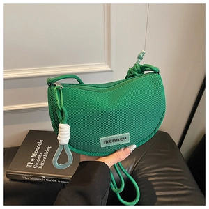 Detail of vibrant green mesh crossbody bag with MEAREY logo and rope strap detail