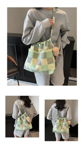 Detail of checkered canvas tote bag with drawstring closure and plush cup pendant