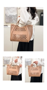 Detail view of the beige cutout tote bag showing the hollow diamond mesh texture and handle