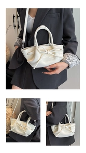 Détails du sac à main crème avec nœud, montrant la texture du cuir et la bandoulière