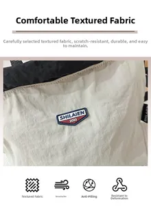 Detail of water-resistant nylon fabric with a durable brand badge and neat stitching
